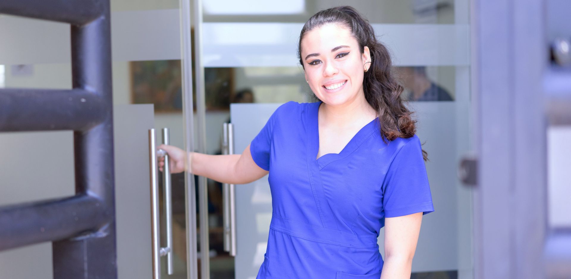 Woman in Blue Scrub Suit Smiling